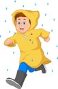 cute boy running wearing raincoat and boots in the rain