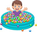 Boy playing with colored balls in the bath Royalty Free Stock Photo