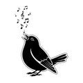 A black bird singing musical notes out Royalty Free Stock Photo