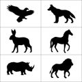 Silhouettes of eagle, wolf, hare, horse, rhino, and lion on white Royalty Free Stock Photo