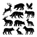 Collection of black animal silhouettes including deer bear fox rabbit and eagle white background. Royalty Free Stock Photo