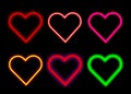 set of Neon heart suit icon. Glowing neon hearts sign, outline card suit symbol and silhouette.Heart neon icons set. Royalty Free Stock Photo