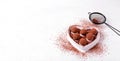 Web banner with chocolate truffles on the heart shaped plate Royalty Free Stock Photo