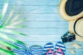web banner flat lay summer time with swimsuit and beach accessories on blue wooden background Royalty Free Stock Photo