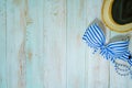 Web banner and flat lay summer time with swimsuit and beach accessories on vintage blue wooden background Royalty Free Stock Photo