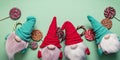 Web banner format. Snow gnomes or elves on a green background. Christmas toy