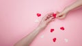 WEB banner. Greeting card blank on a pink background. Children and female hands hold hearts. Top view. Mother`s day or Valentines Royalty Free Stock Photo