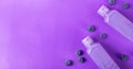 Web banner with shower gel with blueberry on purple