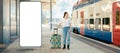 Web banner of travel. Young woman holding her luggage and waiting departure. Big smartphone with mock up and copy space Royalty Free Stock Photo