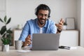 Web Conference. Positive Western Guy In Headset Making Video Call Via Laptop