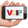 Web design concept: Hand Holding Smartphone with VOIP on display