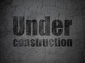 Web design concept: Under Construction on grunge wall background