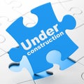 Web design concept: Under Construction on puzzle background Royalty Free Stock Photo