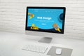 Web design studio concept with modern computer display with web design web site theme concept Royalty Free Stock Photo