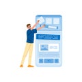 Web designer developing mobile app interface, adding icons and buttons on large smartphone screen Royalty Free Stock Photo