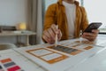 A web developer, as a User Experience and User Interface Officer, is designing beautiful and easy-to-use digital products that