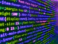 Web developer programmer monitor screen display. Program code PHP HTML CSS of site. Lines of code of a software with several Royalty Free Stock Photo