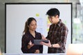Web developer team using modern device and working on mobile application software design project together. Royalty Free Stock Photo