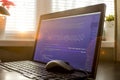Web developer workplace in sunset lights. Web development phrase ASCII art inside real HTML code