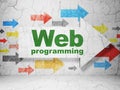 Web development concept: arrow with Web Programming on grunge wall background Royalty Free Stock Photo