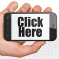 Web development concept: Hand Holding Smartphone with Click Here on display Royalty Free Stock Photo