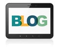 Web development concept: Tablet Computer with Blog on display Royalty Free Stock Photo