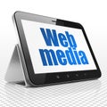 Web development concept: Tablet Computer with Web Media on display Royalty Free Stock Photo