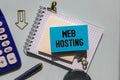 Web hosting business text concept. Text in notebook on table. Royalty Free Stock Photo
