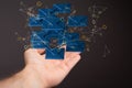 Web of illustrative 3D rendered blue envelope icons floating on a man's palm on a black background