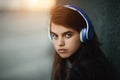 Web radios concept. Portrait of young beautiful girl listening music. Royalty Free Stock Photo