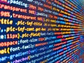 Web site codes on computer monitor. Php code on blue background in code editor. Coding hacker concept. Programmer developer screen Royalty Free Stock Photo
