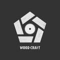 Wood craft logo in gray. Woodworks professional service. Stylized pentagon in wood texture and circular saw.