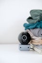 Webcam hidden in a stack of clothes for covert surveillance of the house. Royalty Free Stock Photo