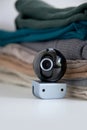 Webcam hidden in a stack of clothes for covert surveillance of the house. Royalty Free Stock Photo