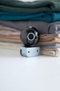Webcam hidden in a stack of clothes for covert surveillance of the house. Royalty Free Stock Photo