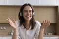 Webcam portrait happy young woman in headphones look at camera