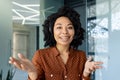 Webcam pov view, video call young beautiful woman with headset phone talking remotely with clients and partners Royalty Free Stock Photo