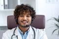 Webcam view, young doctor with headset phone using laptop for video call, doctor cheerfully and friendly consulting Royalty Free Stock Photo