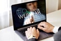 Webinar concept, training on the Internet. man works with a laptop