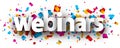 Webinars paper sign over confetti background