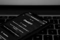 Webpage of ChatGPT, a chatbot prototype on the OpenAI website on a smartphone. on the background of a computer keyboard