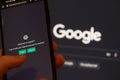 Webpages of chat bot ChatGPT, OpenAI chatbot, and Google logo are seen on smartphones and background