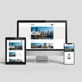 Website display on multiple devices isolated on white background Royalty Free Stock Photo