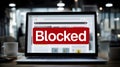 Website showing blocked message on laptop screen in office Royalty Free Stock Photo