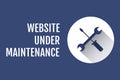 Website under maintenance text with tools graphics against blue background