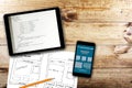 Website wireframe sketch and programming code on digital tablet