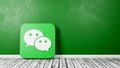 Wechat App Icon on Wooden Floor Against Wall