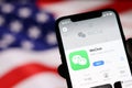 WeChat application on mobile phone screen on USA flag background