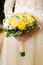 Weddind bouquet with lemons in the hands of bride