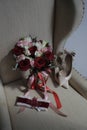 A bride`s bouquet of red and pink roses, women`s shoes, a garter of the bride Royalty Free Stock Photo